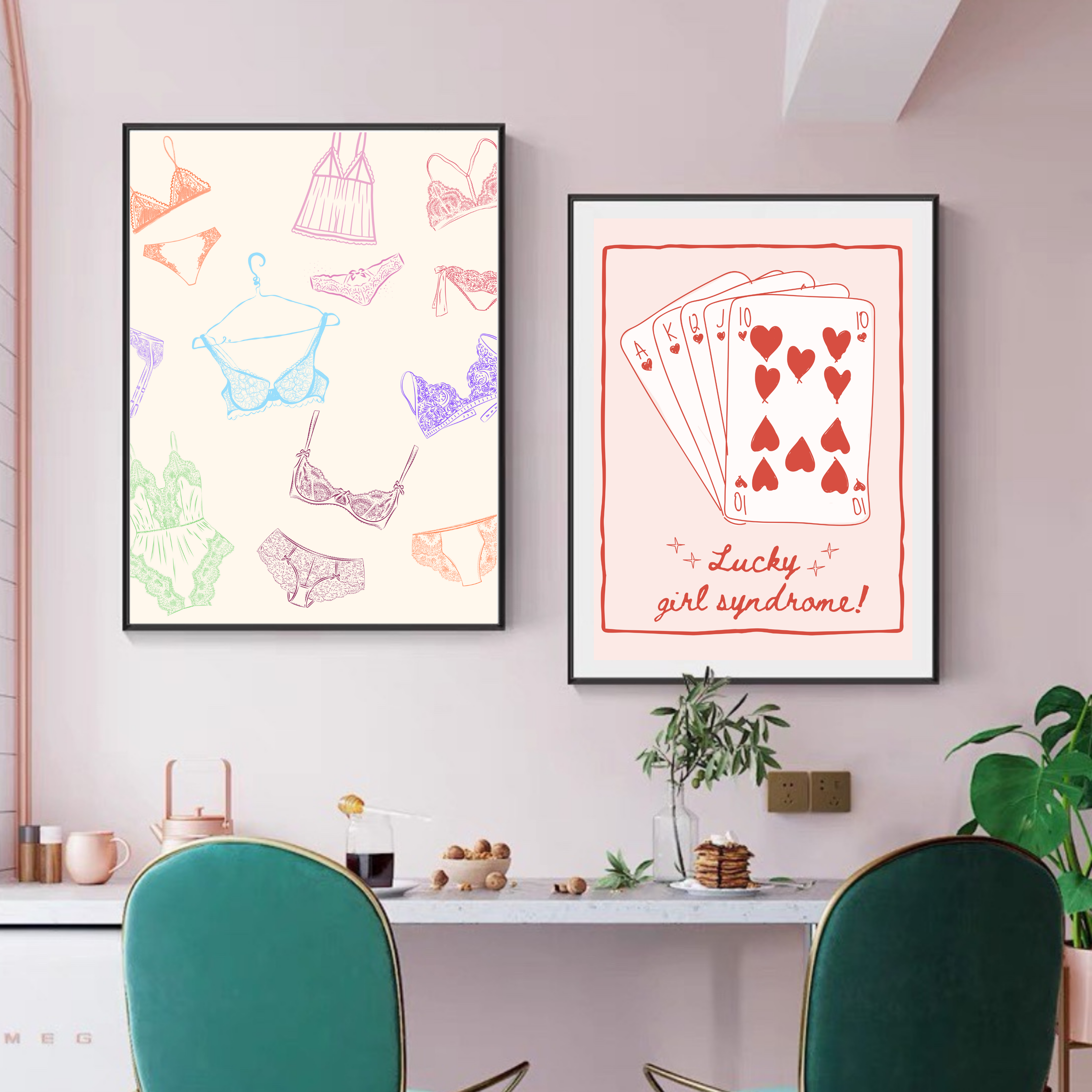 Two framed wall art prints on a pink wall above a modern desk: one with colorful lingerie illustrations, the other with red playing cards and the phrase ‘Lucky girl syndrome.’ Stylish dopamine decor with playful, feminine vibes.”